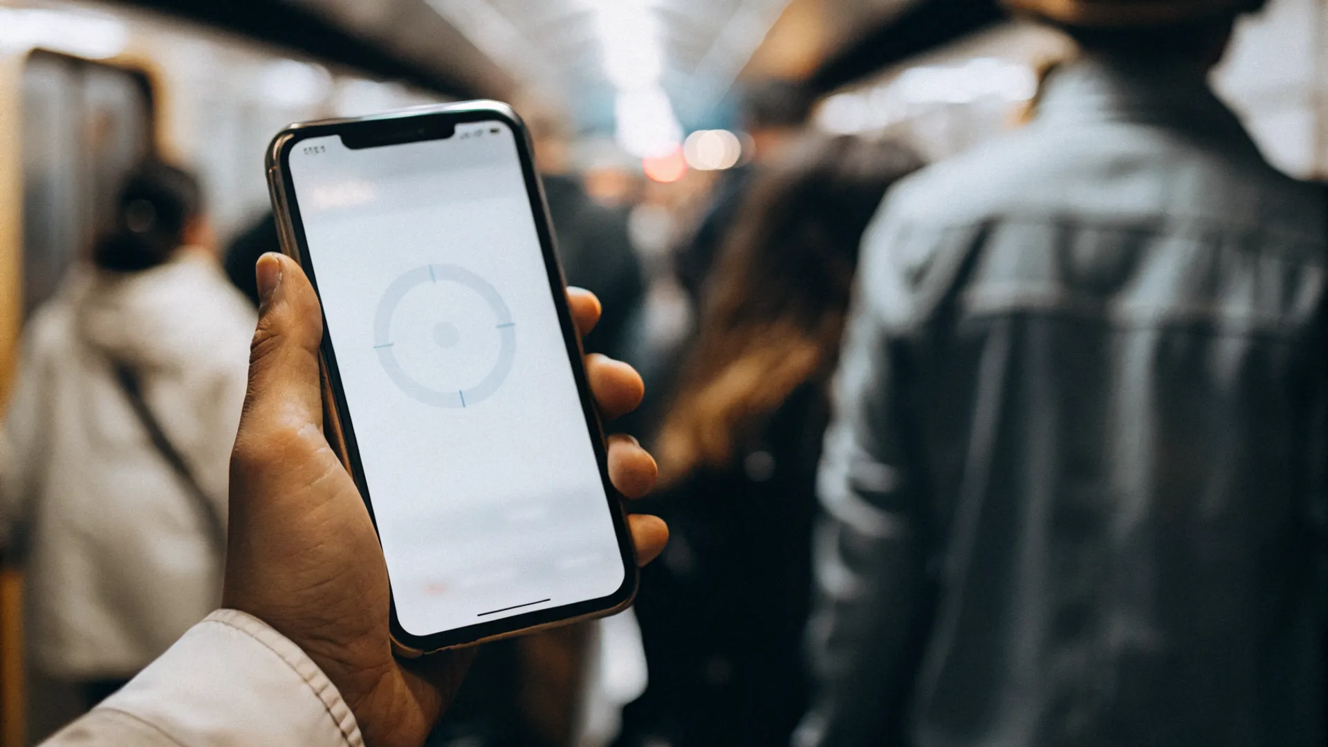Smartphone user waiting impatiently as a website loads slowly on their mobile screen